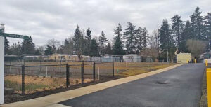 Five new homes have been delivered to a road leading to a mobile home park.
