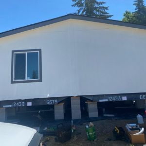 A mobile home is being built on a lot in Clairmont.