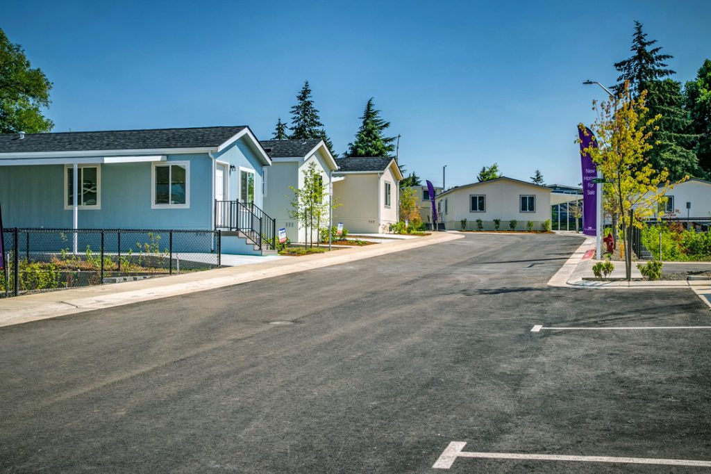 A completion of 17 new mobile homes in a parking lot.